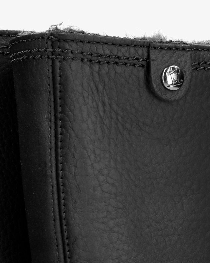 Bambina botas de piel con forro interior de pelo. negro