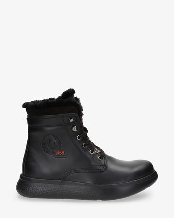 Yael Igloo botas de piel con forro interior de pelo natural. negro